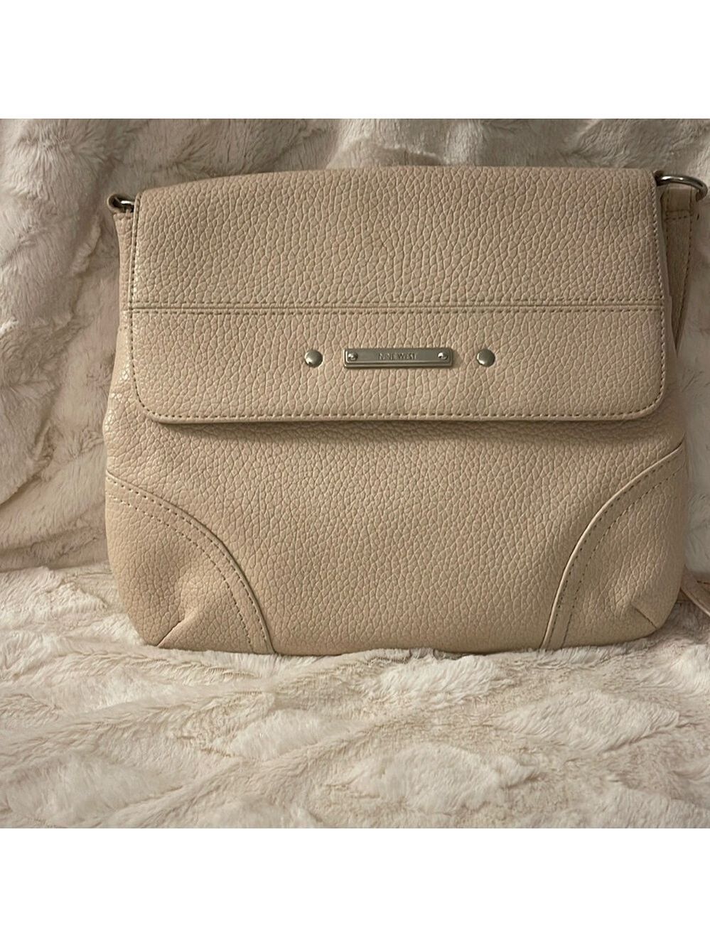 Nine West cream colored crossbody. Natural wear on corners.